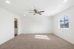 Unfurnished room featuring ceiling fan, light carpet, and recessed lighting