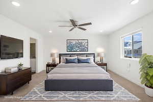 Bedroom with light colored carpet, connected bathroom, ceiling fan, and recessed lighting