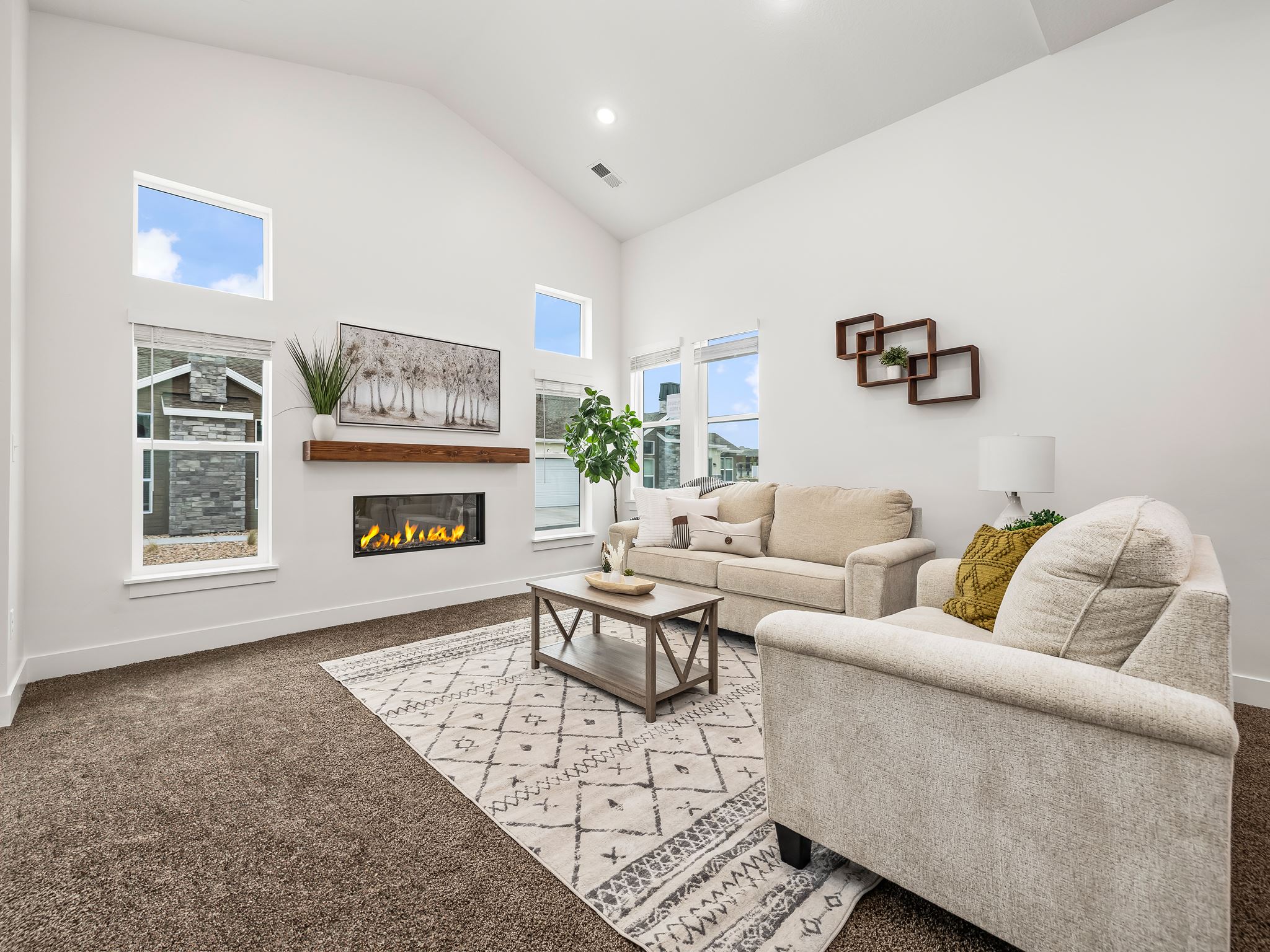 Great room with vaulted ceilings and cozy fireplace.