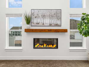 Great room with vaulted ceilings and cozy fireplace.