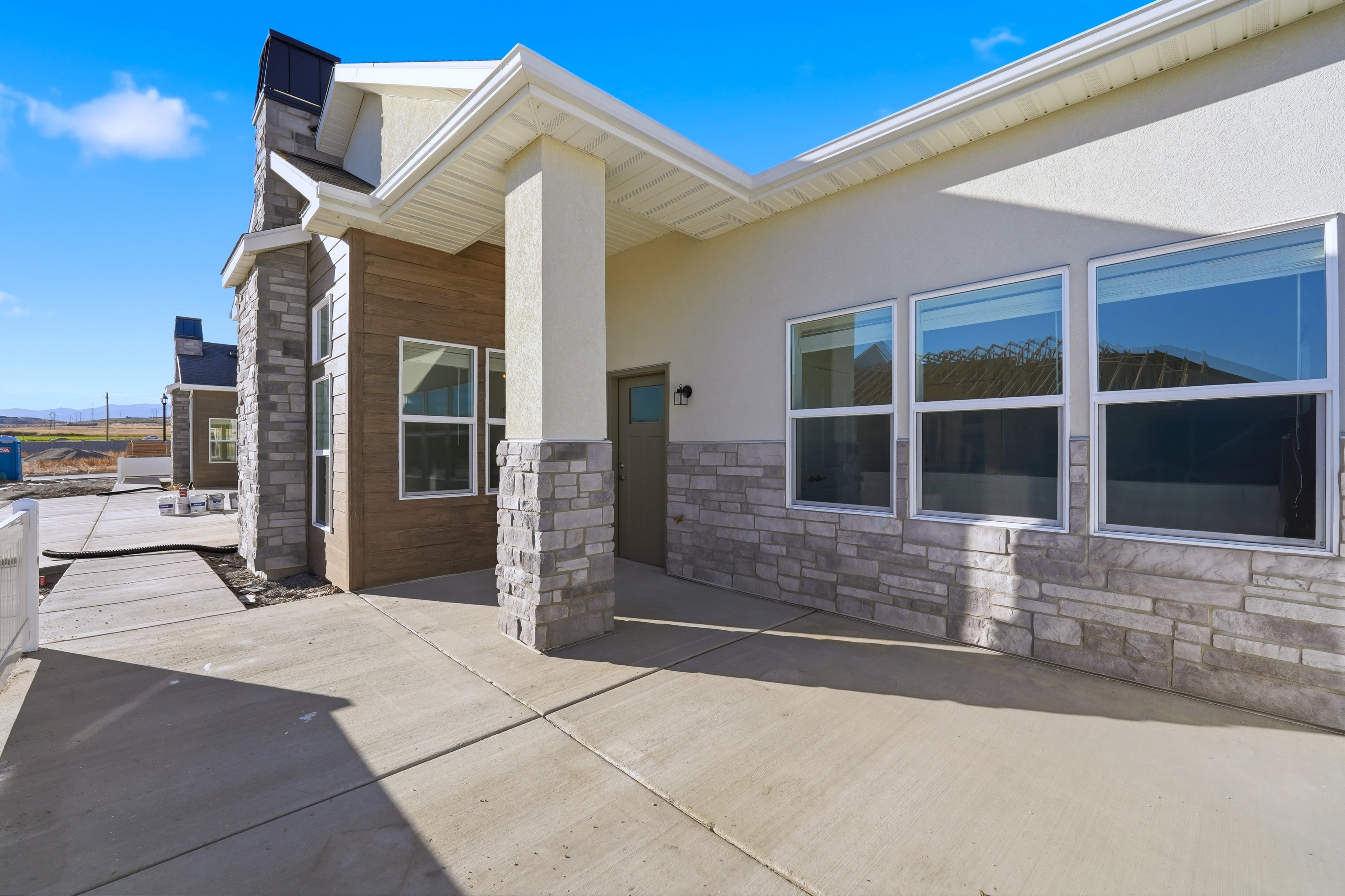 Private partially fenced front patio.