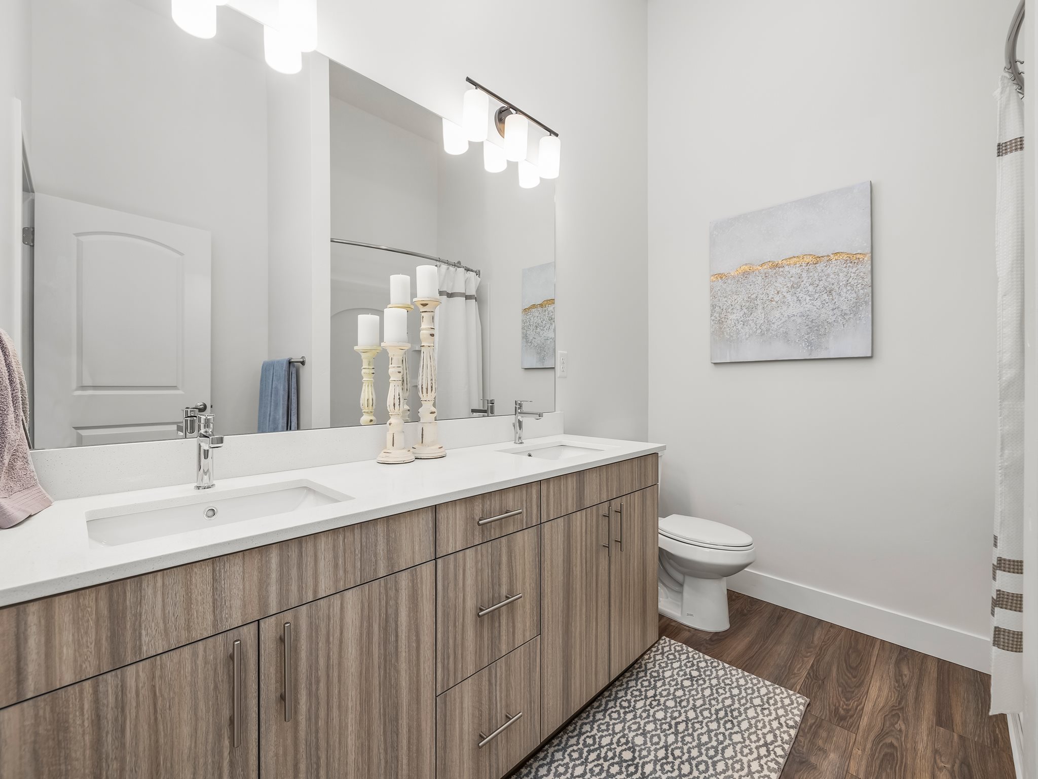 Primary en' suite with double vanity and walk in shower.