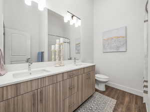 Primary en' suite with double vanity and walk in shower.