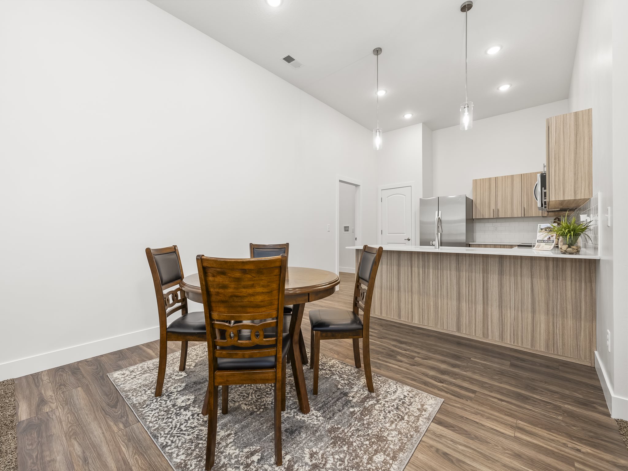 Great room opens to the dining area and kitchen.