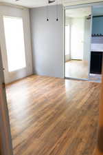 Empty room featuring light wood-style floors and ceiling fan