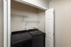 Laundry area featuring independent washer and dryer