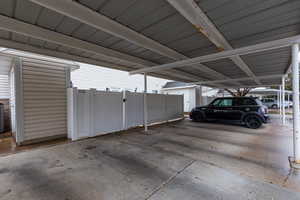 Garage with a gate and covered parking