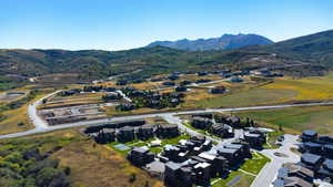 View of property location with a mountainous background and nearby suburban area