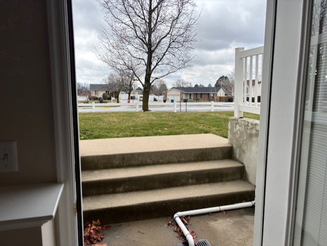 View of grassy yard with a residential view