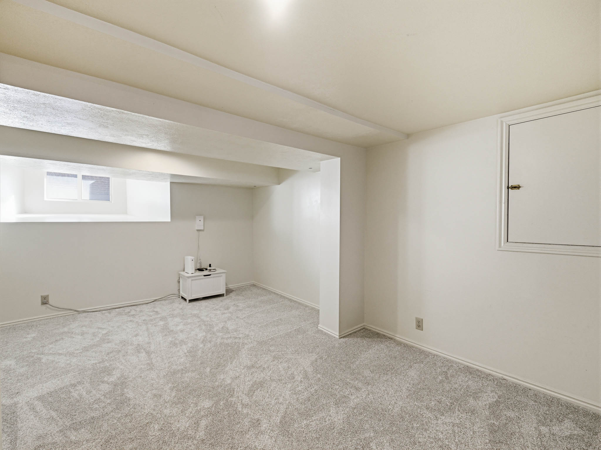 Below grade area featuring carpet flooring and baseboards
