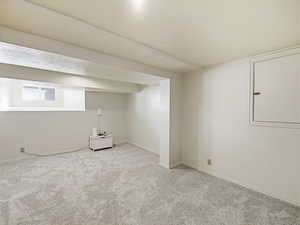 Below grade area featuring carpet flooring and baseboards