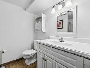 Bathroom with toilet and vanity