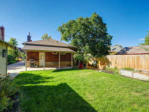 Fenced backyard with a patio area