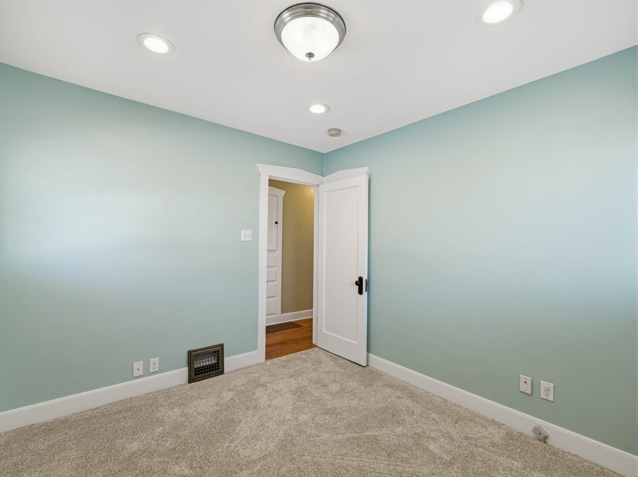 Spare room with carpet and recessed lighting
