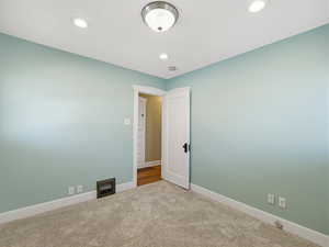 Spare room with carpet and recessed lighting