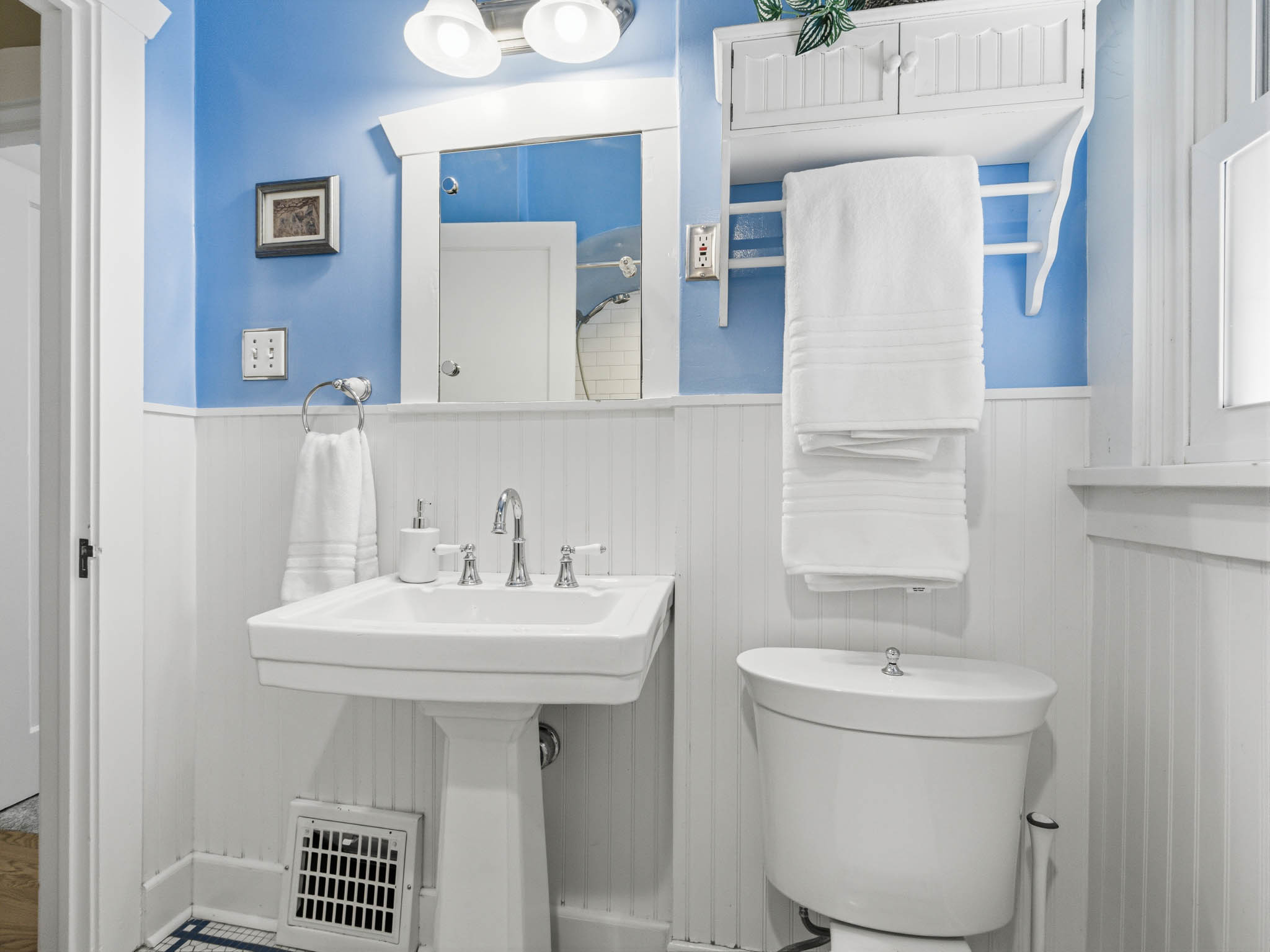 Bathroom with toilet and wainscoting