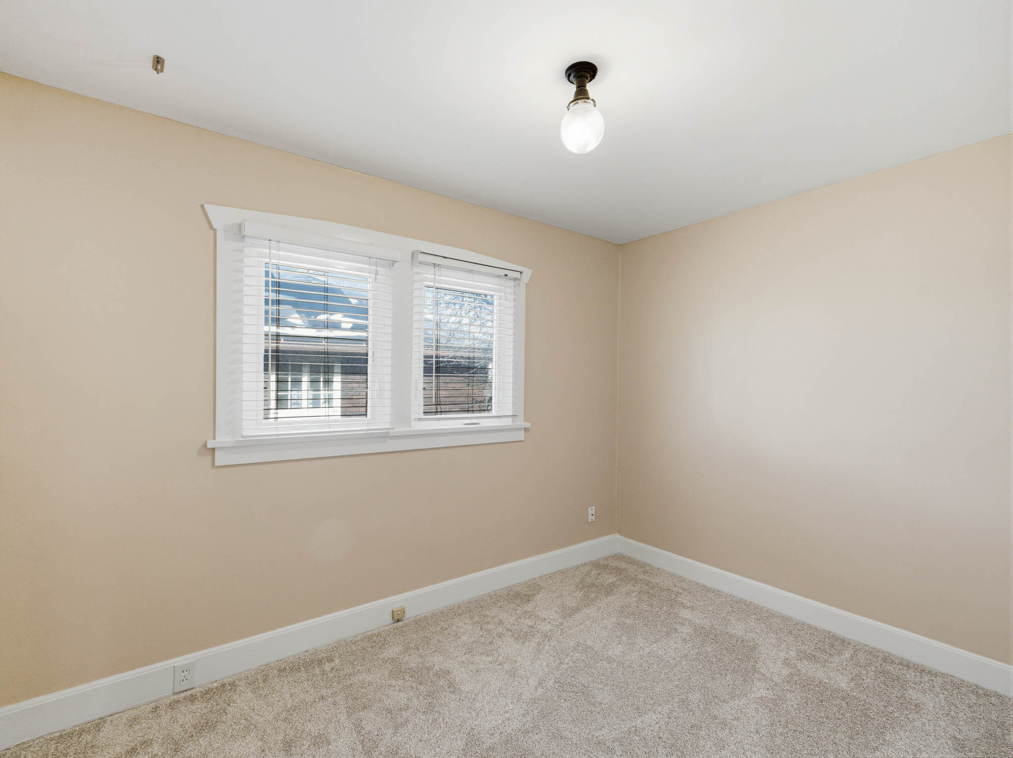 Spare room with carpet flooring and baseboards