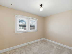Spare room with carpet flooring and baseboards