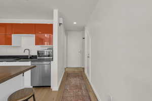 Kitchen featuring stainless steel appliances, recessed lighting, and light wood-style floors
