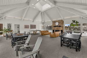 View of patio / terrace with outdoor dining area and a fireplace