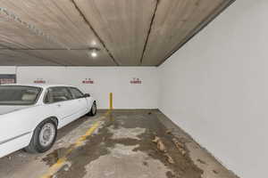 Garage featuring a parking garage