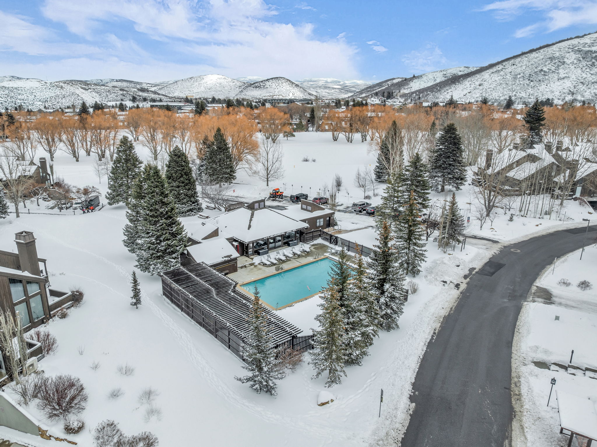 Snowy aerial view featuring a mountain view