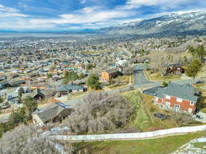 Aerial perspective of suburban area with a mountain backdrop
