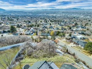 Aerial view of residential area featuring a mountainous background