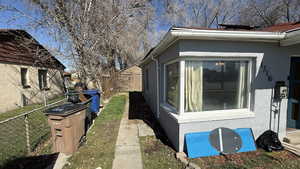 View of side of property featuring stucco siding