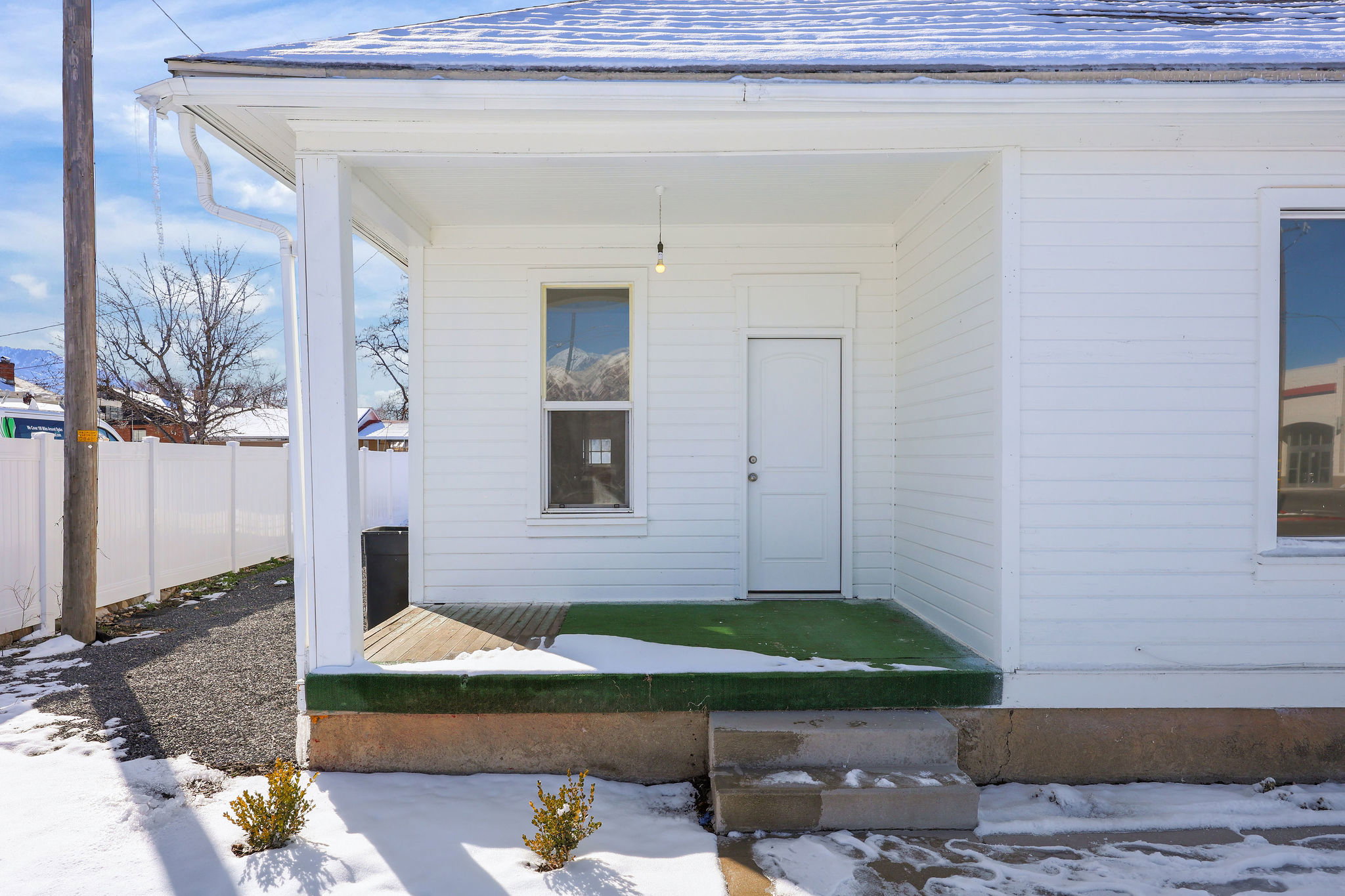 View of snow covered property entrance