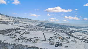 Snowy aerial view with a mountain view