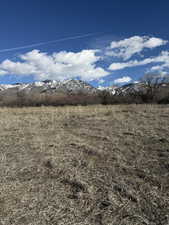 View of mountain backdrop featuring rural landscape