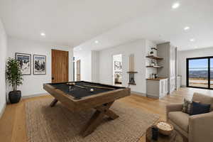Game room featuring pool table, light wood-type flooring, and recessed lighting