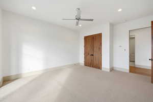 Unfurnished bedroom with carpet flooring, ceiling fan, recessed lighting, and a closet