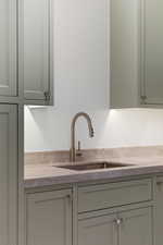 Kitchen featuring light stone counters