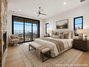 Bedroom featuring access to exterior, a fireplace, light wood-style flooring, ceiling fan, and recessed lighting