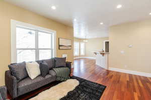 Living room featuring light wood-type flooring and recessed lighting