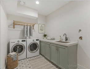 Laundry area featuring washing machine and clothes dryer and cabinet space