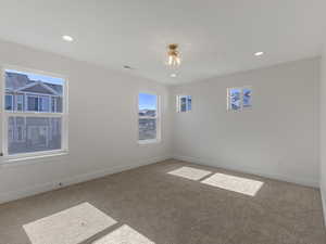 Spare room with carpet and recessed lighting