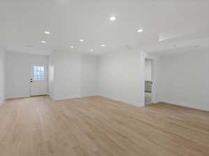 Empty room featuring recessed lighting and light wood-style flooring