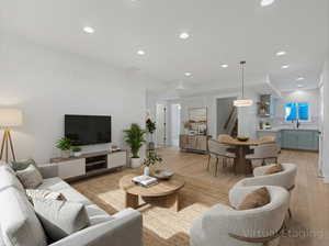 Living room featuring light wood-style flooring and recessed lighting