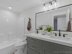 Bathroom with vanity,  shower combination, and light tile patterned flooring