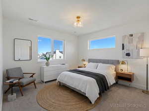 Carpeted bedroom with baseboards