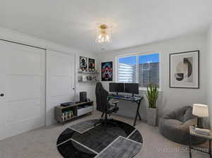Carpeted office with a textured ceiling