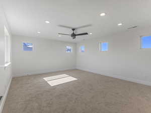 Unfurnished room featuring carpet flooring, recessed lighting, and ceiling fan