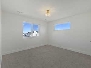 Spare room with carpet flooring and healthy amount of natural light