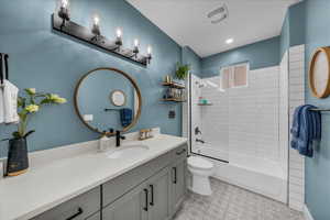 Bathroom featuring vanity and tub / shower combination