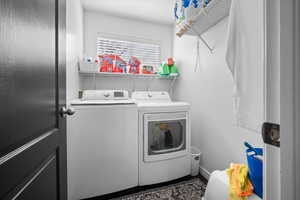 Laundry room with washing machine and clothes dryer