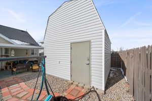 View of outdoor structure with a fenced backyard