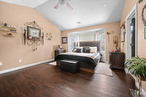 Bedroom featuring hardwood / wood-style flooring, vaulted ceiling, and ceiling fan